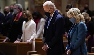 In this Wednesday, Jan. 20, 2021 file photo, President-elect Joe Biden and his wife, Jill Biden, attend Mass at the Cathedral of St. Matthew the Apostle during Inauguration Day ceremonies in Washington. The U.S. Conference of Catholic Bishops will draft a document setting forth the American church’s position on the Eucharist — possibly including instructions on who should, and should not, receive the sacrament, such as President Biden, a Catholic who has expanded abortion funding during his first months in office. (AP Photo/Evan Vucci, File)  **FILE**