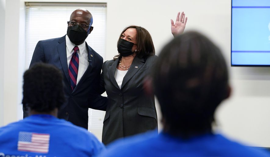 Vice President Kamala Harris stands with Sen. Raphael Warnock, D-Ga., as she speaks at a COVID-19 vaccine pop-up center at Ebenezer Baptist Church, Friday, June 18, 2021, in Atlanta. (AP Photo/Jacquelyn Martin)