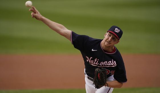 Washington Nationals&#39; Erick Fedde delivers a pitch during the first inning of the team&#39;s baseball game against the New York Mets, Friday, June 18, 2021, in Washington. (AP Photo/Carolyn Kaster)