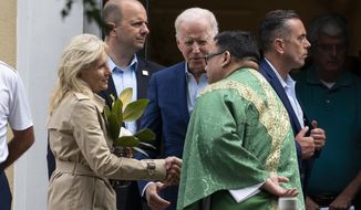 President Joe Biden and first lady Jill Biden speak with a priest as he departs after Mass at St. Joseph on the Brandywine Catholic Church, Saturday, June 19, 2021, in Wilmington, Del. (AP Photo/Alex Brandon)