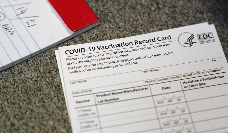 FILE - In this Dec. 24, 2020, file photo, a COVID-19 vaccination record card is shown at Seton Medical Center in Daly City, Calif. California is offering residents to access a digital record of their coronavirus vaccinations they can use to access businesses or events that require proof of inoculation. The state&#x27;s public health and technology departments said Friday, June 18, 2021, the new tool will allow Californians to access their record from the state&#x27;s immunization registry. (AP Photo/Jeff Chiu, File)