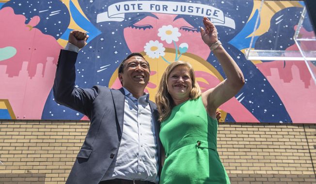 Mayoral candidates Andrew Yang and Kathryn Garcia wave to New Yorkers after speaking at the AAPI Democracy Project&#x27;s &quot;Voting is Justice Rally&quot; in Chinatown on Sunday, June 20, 2021, in New York.  (AP Photo/Brittainy Newman)