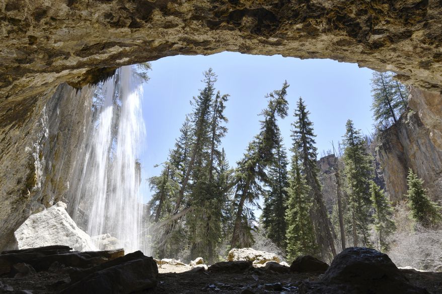 In this Thursday, April 29, 2021, photo is the waterfall of Spotting Rock at Hanging Lake in Glenwood Canyon, Colo. For the high country mayors, commissioners and county managers who have felt required to spend their constituents’ tax dollars maintaining federal forests, the SHRED Act is a welcome alternative to the strange arrangement they’ve put up with for several years. (Hyoung Chang/The Denver Post via AP)