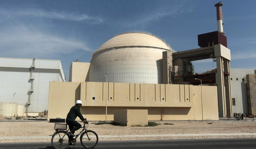 In this Oct. 26, 2010, file photo, a worker rides a bicycle in front of the reactor building of the Bushehr nuclear power plant, just outside the southern city of Bushehr. Iran’s sole nuclear power plant has undergone a temporary emergency shutdown, state TV reported on Sunday, June 20, 2021. An official from the state electric energy company, Gholamali Rakhshanimehr, said on a talk show that the Bushehr plant shutdown began on Saturday and would last &amp;quot;for three to four days.” (AP Photo/Mehr News Agency, Majid Asgaripour, File)