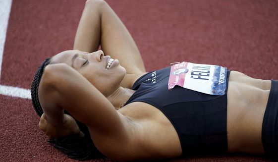 Allyson Felix reacts to her second place in the women&#39;s 400-meter run at the U.S. Olympic Track and Field Trials Sunday, June 20, 2021, in Eugene, Ore. (AP Photo/Ashley Landis)