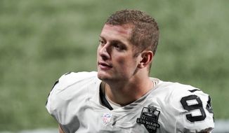 In this Nov. 29, 2020, file photo, Las Vegas Raiders defensive end Carl Nassib leaves the field after an NFL football game against the Atlanta Falcons in Atlanta. Nassib on Monday, June 21, 2021, became the first active NFL player to come out as gay. Nassib announced the news on Instagram, saying he was not doing it for the attention but because “I just think that representation and visibility are so important.” (AP Photo/John Bazemore, File)