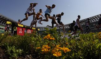 Runners compete during the first heat of the men&#39;s 3000-meter steeplechase at the U.S. Olympic Track and Field Trials Monday, June 21, 2021, in Eugene, Ore. (AP Photo/Charlie Riedel) **FILE**
