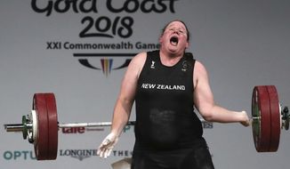 In this April 9, 2018 photo, New Zealand&#39;s Laurel Hubbard reacts after failing to make a lift in the snatch of the women&#39;s +90kg weightlifting final at the 2018 Commonwealth Games on the Gold Coast, Australia.Hubbard will be the first transgender athlete to compete at the Olympics.Hubbard is among five athletes confirmed on New Zealand&#39;s weightlifting team for the Tokyo Games. (AP Photo/Manish Swarup, File)