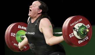 In this April 9, 2018, photo, New Zealand&#39;s Laurel Hubbard reacts after failing to lift in the snatch of the women&#39;s +90kg weightlifting final at the 2018 Commonwealth Games on the Gold Coast, Australia. Hubbard will be the first transgender athlete to compete at the Olympics. Hubbard is among five athletes confirmed on New Zealand&#39;s weightlifting team for the Tokyo Games. (AP Photo/Mark Schiefelbein) **FILE**