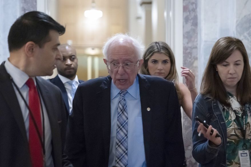 Sen. Bernie Sanders, I-Vt., speaks with reporters as the Senate prepares for a key test vote on the For the People Act, a sweeping bill that would overhaul the election system and voting rights, at the Capitol in Washington, Tuesday, June 22, 2021. The bill is a top priority for Democrats seeking to ensure access to the polls and mail in ballots, but it is opposed by Republicans as a federal overreach. (AP Photo/Alex Brandon)
