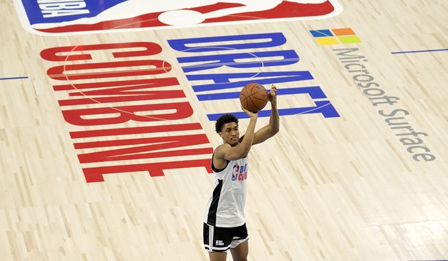 Maryland&#x27;s Aaron Wiggins shoots as he participates in the NBA Draft Combine at the Wintrust Arena Tuesday, June 22, 2021, in Chicago. (AP Photo/Charles Rex Arbogast) **FILE**