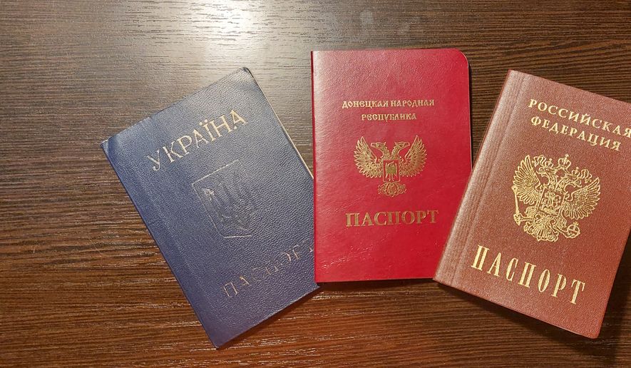 Ukrainian (blue), Donetsk People’s Republic (bright red), and Russian passports are shown here. Photo: ARA Network