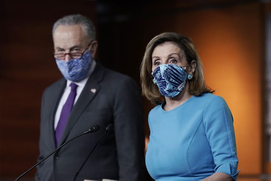 In this Nov. 12, 2020, photo, Speaker of the House Nancy Pelosi, D-Calif., and Senate Minority Leader Chuck Schumer, D-N.Y., meet with reporters on Capitol Hill in Washington. (AP Photo/J. Scott Applewhite) ** FILE **