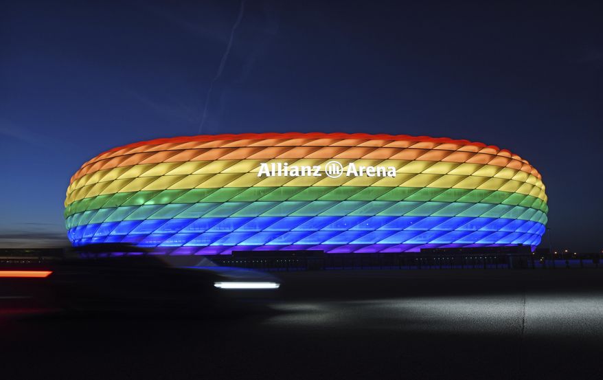 Munich’s stadium is illuminated in rainbow colors on the occasion of Christopher Street Day in Munich, Germany, Saturday, July 9, 2016. UEFA has declined the Munich city council’s application to have its stadium illuminated in rainbow colors for Germany’s final Euro 2020 group game against Hungary on Wednesday, June 23, 2021. (Tobias Hase/dpa via AP)