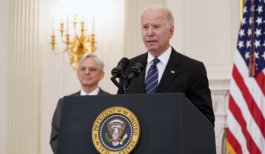 President Joe Biden during an event in the State Dining room of the White House in Washington, Wednesday, June 23, 2021, to discuss gun crime prevention strategy. Attorney General Merrick Garland listens at left. (AP Photo/Susan Walsh)