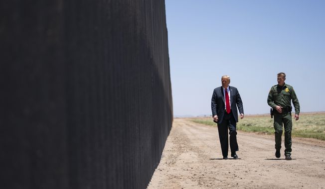 In this June 23, 2020, file photo, United State Border Patrol chief Rodney Scott gives President Donald Trump a tour of a section of the border wall in San Luis, Ariz. Former President Trump  is set to touch down in Texas on Wednesday, June 30, to cast a bright light on what he sees as the Biden administration&#x27;s failed approach to illegal immigration and the “humanitarian crisis” that is playing out in his absence. (AP Photo/Evan Vucci, File)  **FILE**
