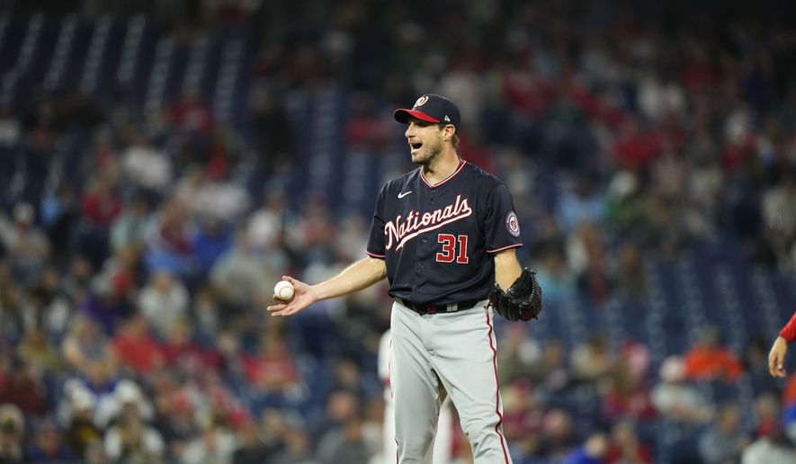 Washington Nationals&#x27; Max Scherzer reacts before being checked for foreign substances during a baseball game against the Philadelphia Phillies, Tuesday, June 22, 2021, in Philadelphia. (AP Photo/Matt Slocum)