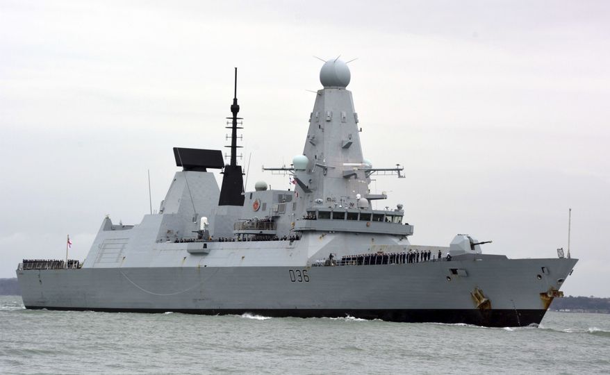 This March 20, 2020, file photo shows HMS Defender in Portsmouth, England. The Russian military says its warship has fired warning shots and a warplane dropped bombs to force the British destroyer from Russia's waters near Crimea in the Black Sea. The incident on Wednesday June 23, 2021, marks the first time since the Cold War era when Moscow used live ammunition to deter a NATO warship, reflecting soaring Russia-West tensions. (Ben Mitchell/PA via AP, File)