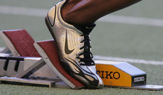 A Nike running shoe is seen in the starting block during the IAAF Athletics World Final in Stuttgart, southern Germany, in this Saturday, Sept 9, 2006, file photo.  (AP Photo/Daniel Maurer, File)  **FILE**