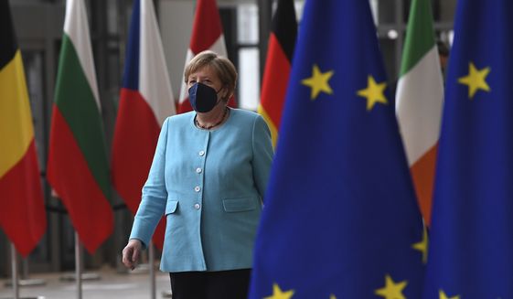 Germany&#x27;s Chancellor Angela Merkel arrives for an EU summit at the European Council building in Brussels, Thursday, June 24, 2021. At their summit in Brussels, EU leaders are set to take stock of coronavirus recovery plans, study ways to improve relations with Russia and Turkey, and insist on the need to develop migration partners with the countries of northern Africa, but a heated exchange over a new LGBT bill in Hungary is also likely. (John Thys, Pool Photo via AP)