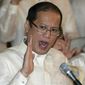In this June 30, 2010, file photo, then newly inaugurated Philippine President Benigno Aquino III, center, swears in local officials during his first day at the Malacanang presidential palace in Manila, Philippines. Aquino, the son of pro-democracy icons who helped topple dictator Ferdinand Marcos and had troublesome ties with China, died Thursday, June 24, 2021, a cousin and public officials said.  (AP Photo/Aaron Favila, File)