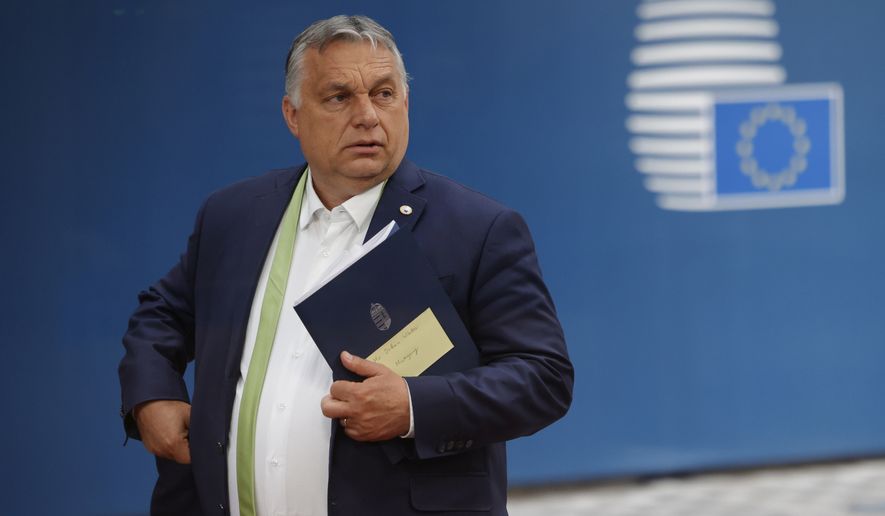 Hungarian Prime Minister Viktor Orban leaves at the end of an EU summit at the European Council building in Brussels, Friday, June 25, 2021. EU leaders discussed the economic challenges the bloc faces due to coronavirus restrictions and will review progress on their banking union and capital markets union. (AP Photo/Olivier Matthys, Pool)
