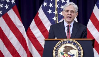 In this June 15, 2021, photo, Attorney General Merrick Garland speaks at the Justice Department in Washington. The Justice Department is suing Georgia over the state&#39;s voting laws, a person familiar with the matter said Friday, June 25. (Win McNamee/Pool via AP) ** FILE **