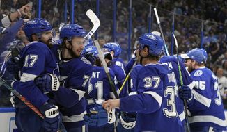 Tampa Bay Lightning players celebrate after defeating the New York Islanders in Game 7 of an NHL hockey Stanley Cup semifinal playoff series Friday, June 25, 2021, in Tampa, Fla. (AP Photo/Chris O&#39;Meara) **FILE**