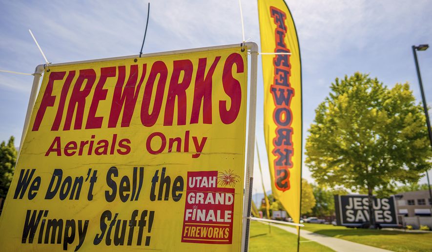 A sign advertising fireworks is shown on Wednesday, June 23, 2021, in American Fork, Utah. July Fourth fireworks are a mainstay summer tradition for Americans, many of whom are aching for normalcy as pandemic restrictions ease. But with a megadrought gripping the West and heightening fears of another devastating wildfire season, officials across the region are enacting bans, canceling displays or begging people to be careful. (Trent Nelson/The Salt Lake Tribune via AP)