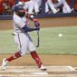Washington Nationals batter Josh Harrison hits an RBI-single against the Miami Marlins during the first inning of a baseball game, Sunday, June 27, 2021, in Miami. (AP Photo/Rhona Wise)