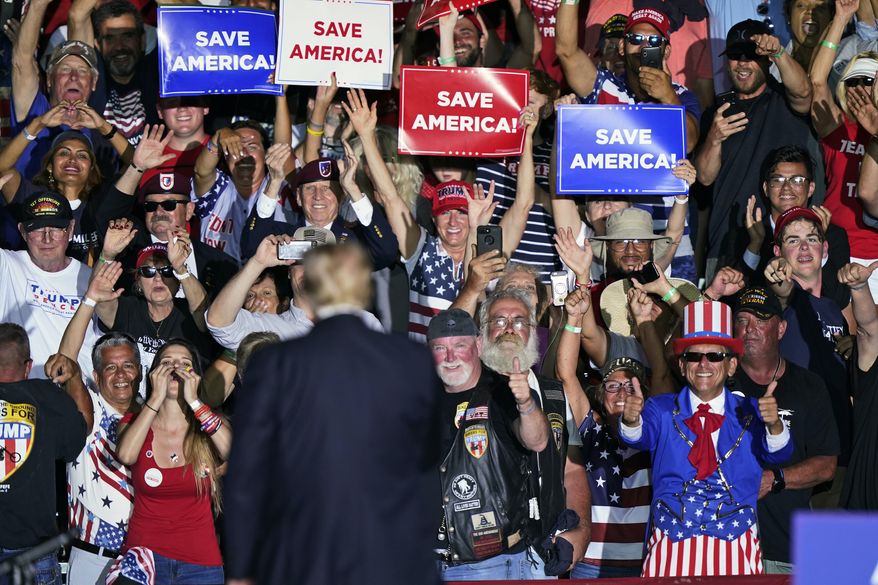 Supporters cheer on former President Donald Trump after he spoke at a rally at the Lorain County Fairgrounds, Saturday, June 26, 2021, in Wellington, Ohio. (AP Photo/Tony Dejak)