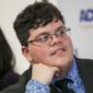 Gavin Grimm, who has become a national face for transgender students, speaks during a news conference held by the ACLU and the ACLU of Virginia at Slover Library in Norfolk, Va. The Supreme Court has rejected a Virginia school board&#39;s appeal to reinstate its transgender bathroom ban. Over two dissenting votes, the justices on Monday, June 28, 2021, left in place lower court rulings that found the policy unconstitutional. (Kristen Zeis/The Daily Press via AP, File)