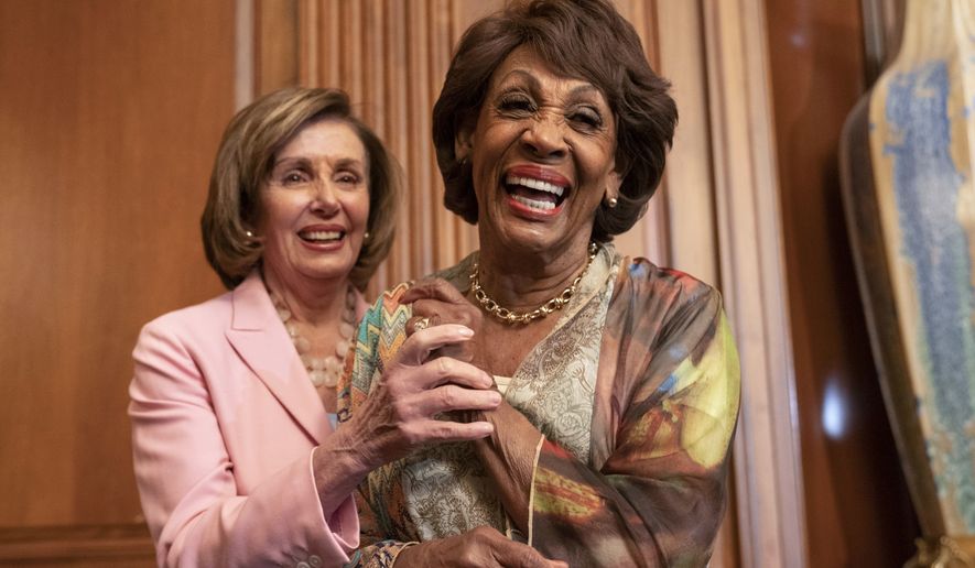 In this file photo, House Speaker Nancy Pelosi of Calif., left, and Rep. Maxine Waters, D-Calif., laugh after Waters told Pelosi a funny story, after Pelosi signed bill enrollments for Congressional Review Act Resolutions S. J. Res. 13, 14 and 15, Tuesday, June 29, 2021, on Capitol Hill in Washington. (AP Photo/Jacquelyn Martin)  **FILE**