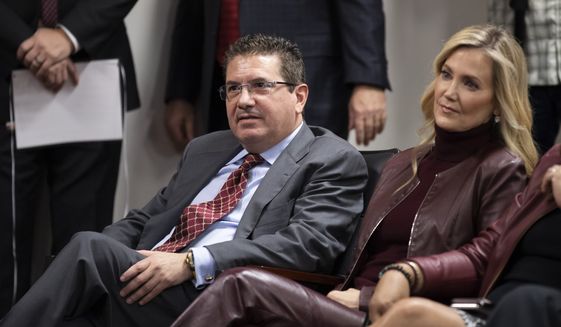 Washington Redskins owner Dan Snyder, left, and his wife Tanya Snyder, listen to head coach Ron Rivera during a news conference at the team&#39;s NFL football training facility in Ashburn, Va., in this Thursday, Jan. 2, 2020, file photo. Dan Snyders wife Tanya was named co-CEO of the Washington Football Team on Tuesday, June 29, 2021, giving her bigger influence in the club that is currently in the midst of an independent investigation into workplace conduct the NFL is overseeing. (AP Photo/Alex Brandon, File) **FILE**
