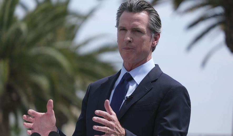 California Governor Gavin Newsom talks during a news conference at Universal Studios in Universal City, Calif., on Tuesday, June 15, 2021.   Newsom is at risk of being on the recall ballot without his party ID – Democrat – next to his name. Newsom&#39;s campaign is suing the Secretary of State, whom he appointed, after they failed to file paperwork on time. (AP Photo/Ringo H.W. Chiu)