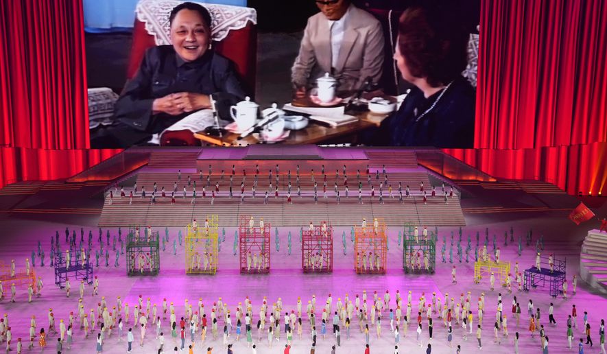 In this file photo, late Chinese leader Deng Xiaoping is displayed on screen during a gala show ahead of the 100th anniversary of the founding of the Chinese Communist Party in Beijing on Monday, June 28, 2021. The communists have ruled China single-handedly for more than 70 years since Mao Zedong led them to power in 1949. After his death in 1976, they started a sharp turn under then-leader Deng, embracing a market economy that has transformed what was a poor country into an economic power. (AP Photo/Ng Han Guan) **FILE**