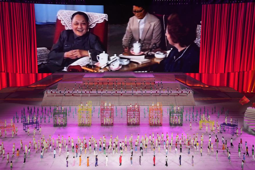 In this file photo, late Chinese leader Deng Xiaoping is displayed on screen during a gala show ahead of the 100th anniversary of the founding of the Chinese Communist Party in Beijing on Monday, June 28, 2021. The communists have ruled China single-handedly for more than 70 years since Mao Zedong led them to power in 1949. After his death in 1976, they started a sharp turn under then-leader Deng, embracing a market economy that has transformed what was a poor country into an economic power. (AP Photo/Ng Han Guan) **FILE**