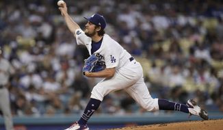 Los Angeles Dodgers starting pitcher Trevor Bauer throws against the San Francisco Giants during the third inning of a baseball game, Monday, June 28, 2021, in Los Angeles. (AP Photo/Jae C. Hong)