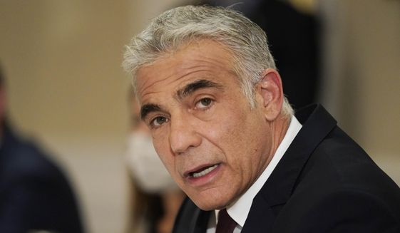In this June 27, 2021, file photo, Israeli Foreign Minister Yair Lapid meets with Secretary of State Antony Blinken in Rome. Israel&#39;s new foreign minister is heading to the United Arab Emirates for a state visit, the first high-level delegation by an Israeli official since the two countries signed an agreement to normalize relations last year. Lapid took off on Tuesday, June 29, for Abu Dhabi, where he will inaugurate the new Israeli Embassy and meet Emirati ministers. (AP Photo/Andrew Harnik, File)