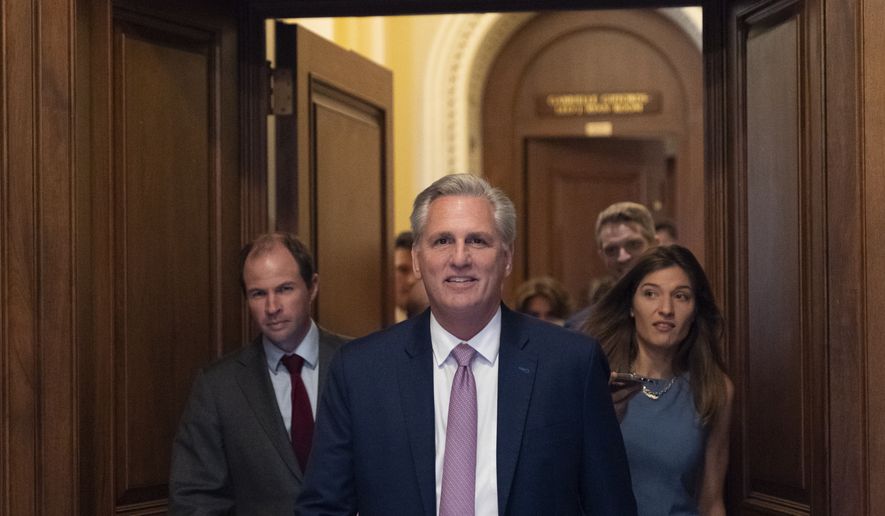 House Minority Leader Kevin McCarthy of Calif., center, leaves the floor after the House voted to create a select committee to investigate the Jan. 6 insurrection, at the Capitol in Washington, Wednesday, June 30, 2021. (AP Photo/Alex Brandon)