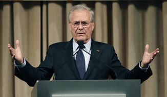 FILE - In this Oct. 11, 2011, file photo, former U.S. Secretary of Defense Donald Rumsfeld speaks to politicians and academics during a luncheon on security in rising Asia, in Taipei, Taiwan. The family of Rumsfeld says he has died. He was 88. (AP Photo/Wally Santana, File)