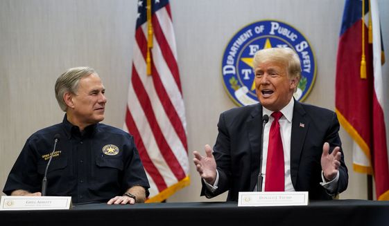 Texas Gov. Greg Abbott and former President Donald Trump attend a briefing with state officials and law enforcement at the Weslaco Department of Public Safety DPS Headquarters before touring the U.S.-Mexico border wall on Wednesday, June 30, 2021, in Weslaco, Texas.  Trump was invited to South Texas by  Abbott, who has taken up Trump&#x27;s immigration mantle by vowing to continue building the border wall. (Jabin Botsford/The Washington Post via AP, Pool)