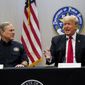 Texas Gov. Greg Abbott and former President Donald Trump attend a briefing with state officials and law enforcement at the Weslaco Department of Public Safety DPS Headquarters before touring the U.S.-Mexico border wall on Wednesday, June 30, 2021, in Weslaco, Texas.  Trump was invited to South Texas by  Abbott, who has taken up Trump&#x27;s immigration mantle by vowing to continue building the border wall. (Jabin Botsford/The Washington Post via AP, Pool)