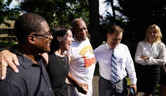 Bill Cosby, center, listens to members of his team speak with members of the media outside Cosby&#39;s home in Elkins Park, Pa., Wednesday, June 30, 2021, after Pennsylvania&#39;s highest court overturned his sex assault conviction. (AP Photo/Matt Rourke) ** FILE **