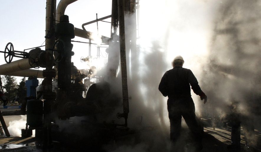 In this Nov. 17, 2007, file photo, a worker repairs a part of a unit of the Tehran oil refinery in Tehran, Iran. (AP Photo/Vahid Salemi) ** FILE **