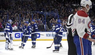 Montreal Canadiens right wing Corey Perry (94) skates off the ice as Tampa Bay Lightning goaltender Andrei Vasilevskiy is greeted by teammates after the third period in Game 2 of the NHL hockey Stanley Cup finals, Wednesday, June 30, 2021, in Tampa, Fla. The Lightning won 3-1. (AP Photo/Phelan Ebenhack) **FILE**