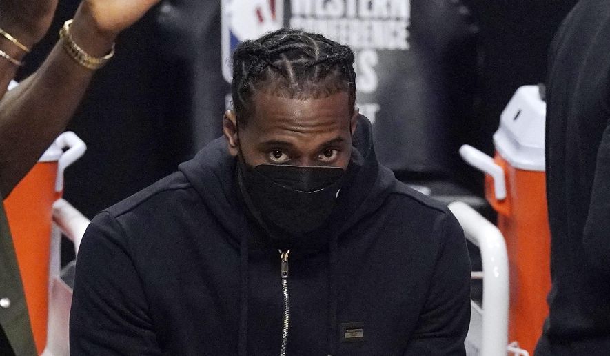 Los Angeles Clippers forward Kawhi Leonard sits on the bench during the first half in Game 6 of the NBA basketball Western Conference Finals against the Phoenix Suns Wednesday, June 30, 2021, in Los Angeles. (AP Photo/Mark J. Terrill) ** FILE **