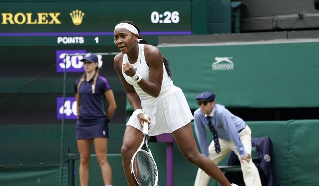 Coco Gauff of the US celebrates winning a point against Russia&#x27;s Elena Vesnina during the women&#x27;s singles second round match on day four of the Wimbledon Tennis Championships in London, Thursday July 1, 2021. (AP Photo/Alberto Pezzali)