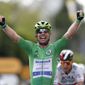 Britain&#39;s Mark Cavendish, wearing the best sprinter&#39;s green, celebrates as he crosses the finish line to win the sixth stage of the Tour de France cycling race over 160.6 kilometers (99.8 miles) with start in Tours and finish in Chateauroux, France, Thursday, July 1, 2021. (Guillaume Horcajuelo, Pool Photo via AP)