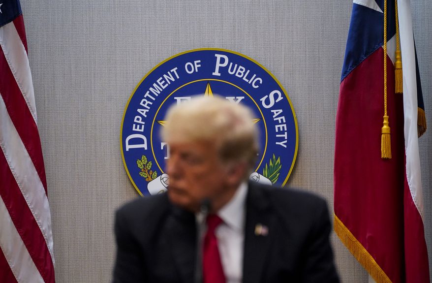 Former President Donald J. Trump attends a security briefing with Texas Governor Greg Abbott and state officials and law enforcement at the Weslaco Department of Public Safety DPS Headquarters before touring the US-Mexico border wall on Wednesday, June 30, 2021, in Weslaco, Texas. (Jabin Botsford/The Washington Post via AP, Pool) **FILE**
